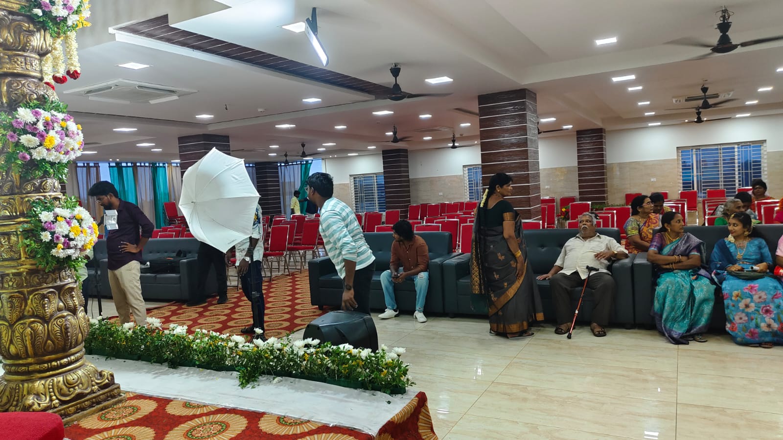 Buchiraju Conventions - Elegant banquet hall with chandeliers and round tables